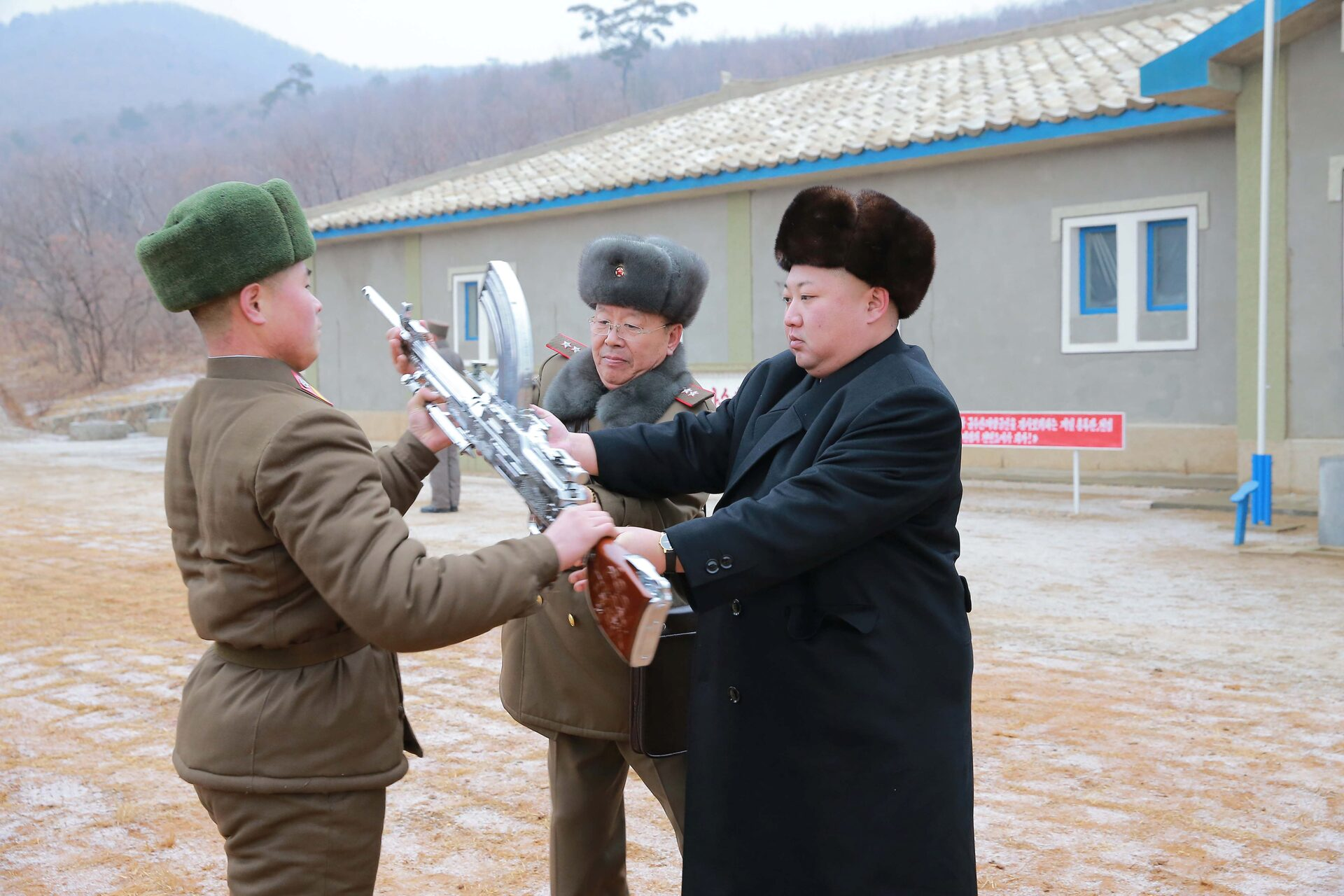 Kim Jong Un passing a chrome skin weapon to a comrade