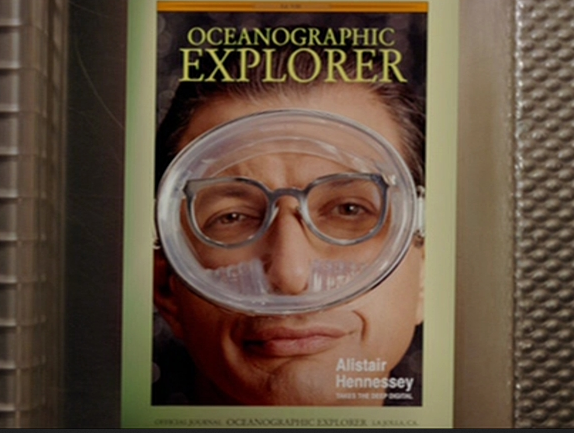 Alistair Hennessey (Jeff Goldblum) on the cover of Oceanographic Explorer magazine, wearing glasses under his diving mask