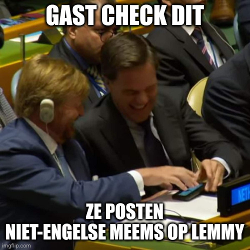 Former Dutch Prime Minister Mark Rutte and King Willem-Alexander looking at memes at the UN