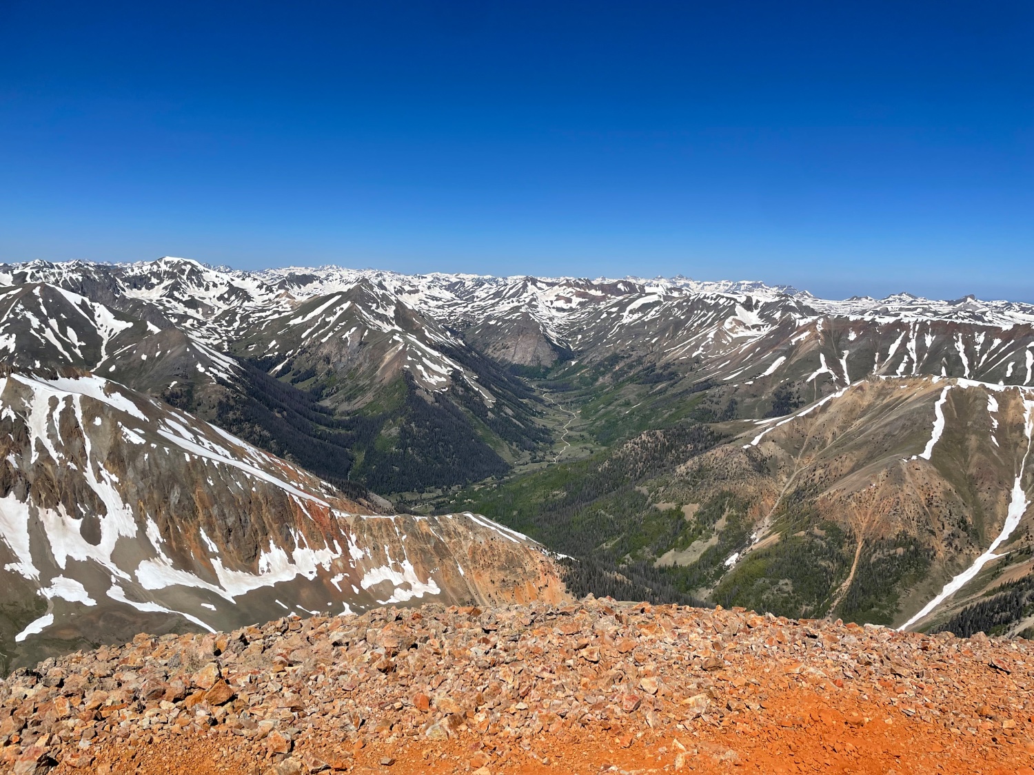 From the Redcloud summit, lots of little snowy peaks in the distance 
